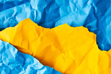 Blue and yellow screwed up paper texture