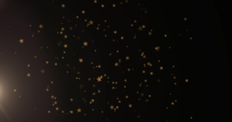Image of lights and falling stars over black background