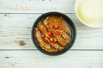 Raw salmon in soy sauce marinated sprinkle red chili and white sesame. Good tasty dish.