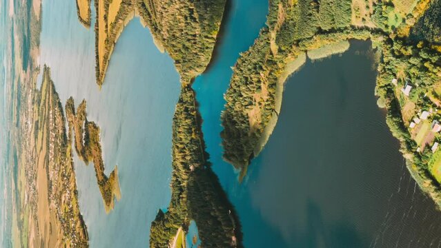 Vertical, Vertical Shot Time lapse Dronelapse Hyperlapse Of Lyepyel Cityscape Skyline. Morning Fog Above Lepel Lake. Top View Of European Nature From High Attitude In Autumn. Bird's Eye View Of Island