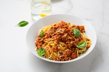 Close up of bolognese spaghetti tomato sauce basil food