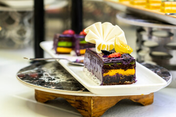 Chocolate cakes on a plate in a hotel minibar