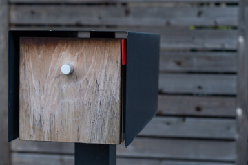Mailbox in front of fence 