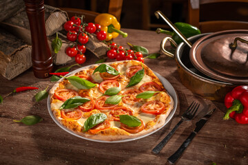 Traditional Italian pizza with basilico, mozzarela, tomatoes and pomodoro