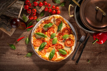 Traditional Italian pizza with basilico, mozzarela, tomatoes and pomodoro