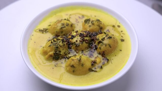 kadhi pakora is ready to serve, tempering with ground spices roasted in desi ghee