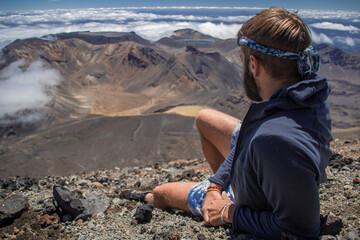 Man watching the volcanos after trekking