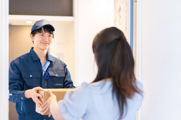 Young woman receiving a parcel delivery