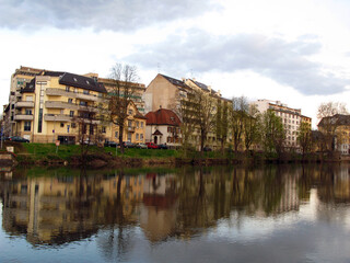 View of the other side of the river Ile Strasbourg, houses are reflected in the river, spring, April 2009, France