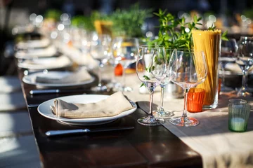 Fotobehang Table set for wedding or another catered event dinner. Italian villa © tsezarina