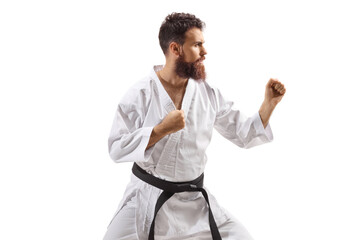 Profile shot of a bearded man in kimono practicing karate © Ljupco Smokovski