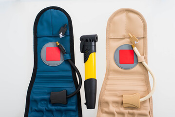 Fototapeta premium pneumocorset and hand pump on a white background