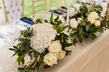 Bouquets flower in vase on the wedding table