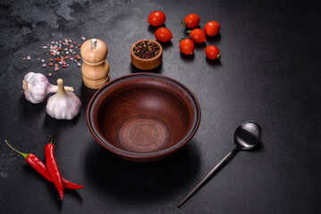 An empty plate with a knife, fork or spoon with a wooden cutting board