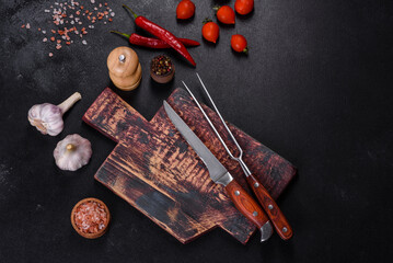 An empty plate with a knife, fork or spoon with a wooden cutting board