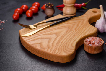 An empty plate with a knife, fork or spoon with a wooden cutting board