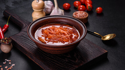 Traditional Ukrainian borscht with beets, tomatoes, garlic, spices and herbs. Ukrainian dish, traditional food