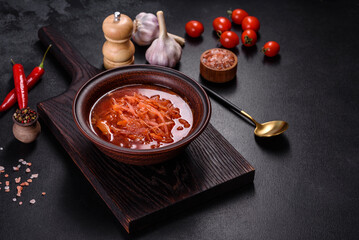 Traditional Ukrainian borscht with beets, tomatoes, garlic, spices and herbs. Ukrainian dish, traditional food
