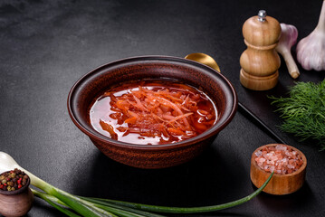 Traditional Ukrainian borscht with beets, tomatoes, garlic, spices and herbs. Ukrainian dish, traditional food