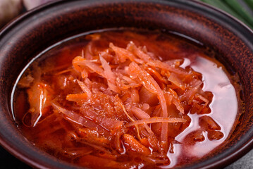 Traditional Ukrainian borscht with beets, tomatoes, garlic, spices and herbs. Ukrainian dish, traditional food