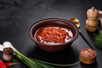Traditional Ukrainian borscht with beets, tomatoes, garlic, spices and herbs. Ukrainian dish, traditional food