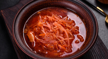 Traditional Ukrainian borscht with beets, tomatoes, garlic, spices and herbs. Ukrainian dish, traditional food