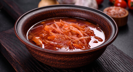 Traditional Ukrainian borscht with beets, tomatoes, garlic, spices and herbs. Ukrainian dish, traditional food