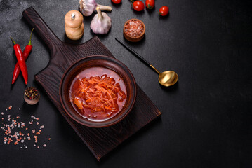 Traditional Ukrainian borscht with beets, tomatoes, garlic, spices and herbs. Ukrainian dish, traditional food