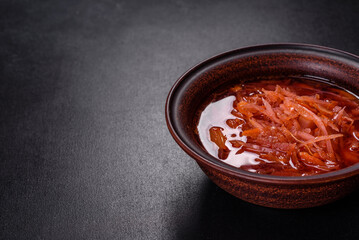 Traditional Ukrainian borscht with beets, tomatoes, garlic, spices and herbs. Ukrainian dish, traditional food