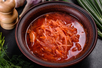 Traditional Ukrainian borscht with beets, tomatoes, garlic, spices and herbs. Ukrainian dish, traditional food