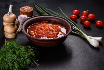 Traditional Ukrainian borscht with beets, tomatoes, garlic, spices and herbs. Ukrainian dish, traditional food