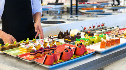 The chef decorates cakes in the hotel bar