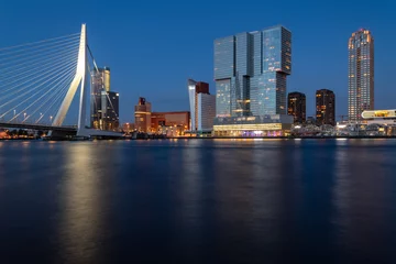 Keuken spatwand met foto Rotterdam nighttime panorama with “Erasmus-Bridge“ over river Nieuwe Maas at evening blue hour in South Holland Netherlands. Waterfront with illuminated bridge and tall buildings on the waterfront. © ON-Photography