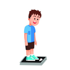 a boy weighs himself while looking at the weight indicator