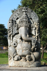Fototapeta na wymiar Huge stone Ganesha statue at western entrance of Hoysaleswara temple, Halebidu temple, Halebidu, Hassan District of Karnataka state, India. The temple was built in 12th-century rule of Hoysala Empire.