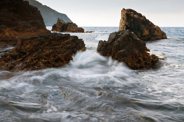 waves crashing on rocks