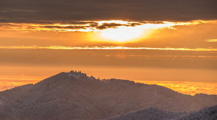 Jamnik on a beautiful winter morning with fresh snow and a vivid sunrise.  