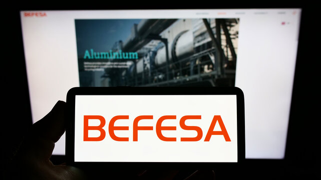 Stuttgart, Germany - 05-21-2022: Person holding mobile phone with logo of recycling company Befesa S.A. on screen in front of business web page. Focus on phone display.
