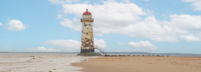 panoramic of  Point of Ayr Lighthouse on Talacre beach at low tide, north wales