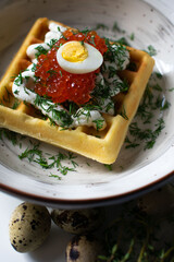 red caviar on a waffle, breakfast serving