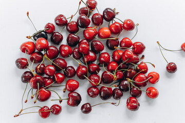 Naklejka na ściany i meble Close-up of fresh cherry berries with water drops.