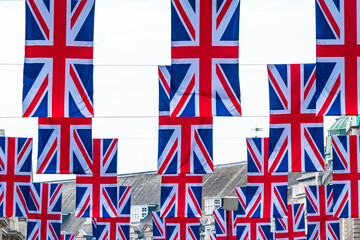 Rows of Union flags above Regent Street mark the Queen`'s Platinum Jubilee celebrations. Selective focus