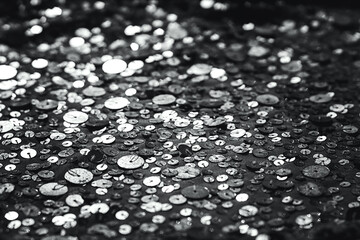 Fabric Silver texture with spangles. Background sequin. Glitter texture. Fabric sequins. Iron cloth. Sequins pattern. Abstract background. Metal structure. Dark thing. Black cloth.