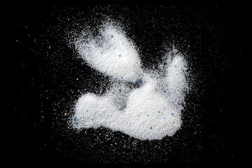 White powder, laundry detergent, washing powder isolated on black, top view
