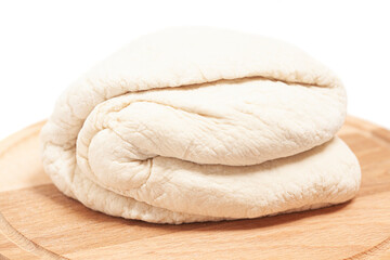 Fresh yeast dough on cutting board