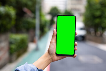 Green screen on mobile phone in the street