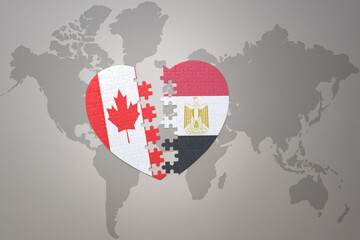 puzzle heart with the national flag of canada and egypt on a world map background.Concept.