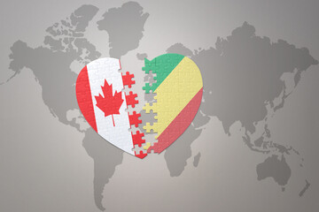 puzzle heart with the national flag of canada and republic of the congo on a world map background.Concept.