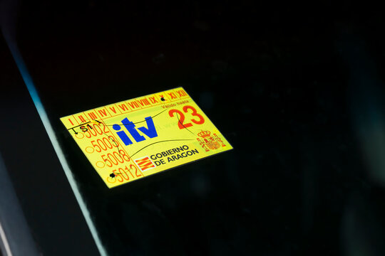 Zaragoza, Spain, January 2022, ITV (Inspecci&oacute;n T&eacute;cnica de Veh&iacute;culos) label on the front of a car