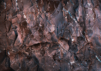 Wall marble. Brown texture. Stone background. Rock texture. Grunge Rough structure. Abstract texture. Rock surface with cracks. Rock pile. Paint spots wall.